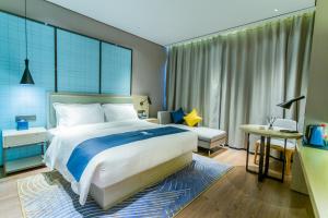 صورة لـ Echarm Hotel Qujing High-speed Railway Station Five Pavilions and One Center Branch في Qujing