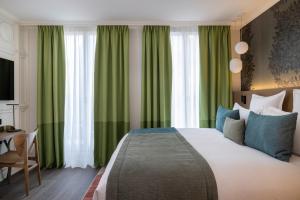 Postel nebo postele na pokoji v ubytování Hôtel L'Ormaie & Spa