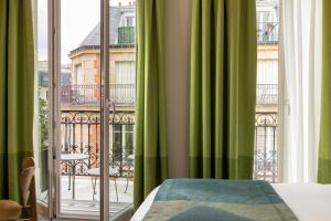 Postel nebo postele na pokoji v ubytování Hôtel L'Ormaie & Spa