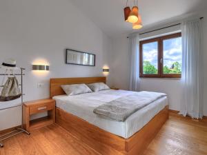 Ένα ή περισσότερα κρεβάτια σε δωμάτιο στο Villa Luna Nera by Interhome