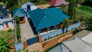 an overhead view of a house with a green roof at Kwetu Maili6Homes 02 in Moshi