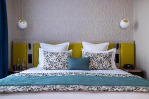 Postel nebo postele na pokoji v ubytování Hôtel L'Ormaie & Spa