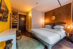 Postel nebo postele na pokoji v ubytování Hotel V Nesplein