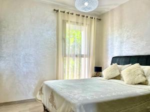 En eller flere senge i et værelse på Appt: Evasion Océanique