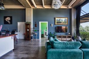 TV o dispositivi per l'intrattenimento presso Zephyr Luxe Apartment Sea and Mountain View