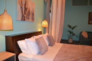 Letto o letti in una camera di Zephyr Luxe Apartment Sea and Mountain View