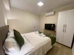 Postel nebo postele na pokoji v ubytování PRUVA İNN HoTEL