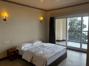Postel nebo postele na pokoji v ubytování Asraya Homestay