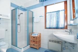 a bathroom with a sink toilet and a shower at Haus Bergblick in Faak am See +43 photos