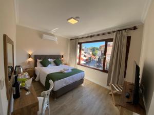 Postel nebo postele na pokoji v ubytování PRUVA İNN HoTEL