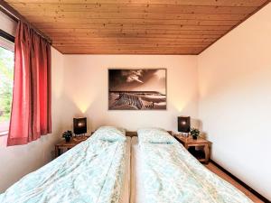 Postel nebo postele na pokoji v ubytování Holiday Home Andrea by Interhome