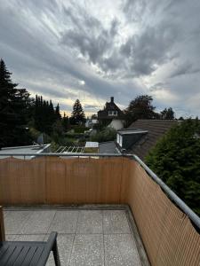 a view of a backyard with a fence and a house at Alex Apartments 3 in Solingen