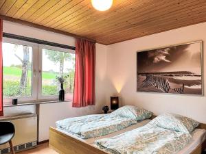 Postel nebo postele na pokoji v ubytování Holiday Home Andrea by Interhome