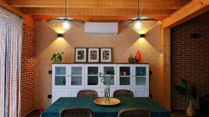 a dining room with a table and two lights at La Moña Casa Rural in Rueda