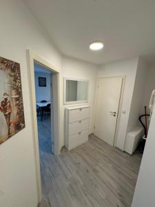 an empty room with a bedroom with a dresser at Alex Apartments 3 in Solingen