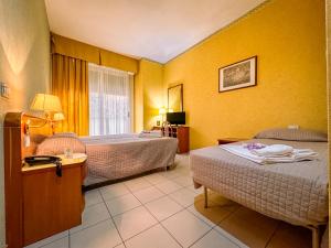 Postel nebo postele na pokoji v ubytování Hotel Remin Plaza