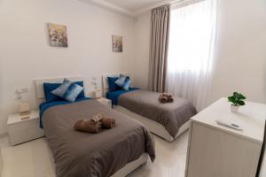 Llit o llits en una habitació de Luxury 3BR in Marsascala with Balcony & Private Yard