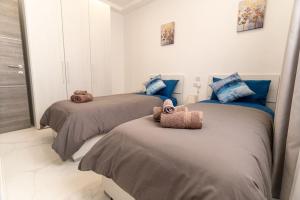 Llit o llits en una habitació de Luxury 3BR in Marsascala with Balcony & Private Yard