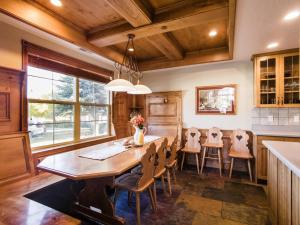 a dining room with a wooden table and chairs at 3 Bedroom 3 Bathroom Zermatt Villages 773 condo in Midway
