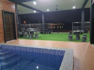 Bazén v ubytování RumaMataAyer Homestay Islam Semabok Perdana - Melaka nebo v jeho okolí