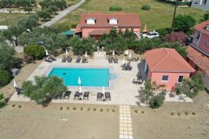 an aerial view of a house with a swimming pool at Villasabella in Laganas