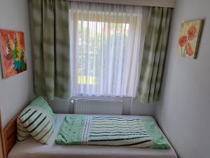 Łóżko lub łóżka w pokoju w obiekcie Apartment Katzer