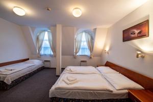Postel nebo postele na pokoji v ubytování Hotel Armales