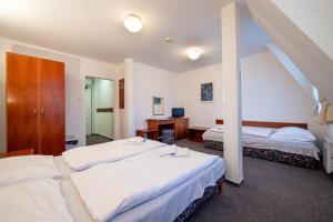 Postel nebo postele na pokoji v ubytování Hotel Armales