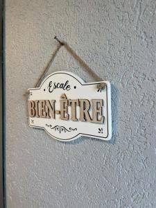 a sign that says seize benlie hanging on a wall at Lilas, Dahlia, Palme Bleue in Saint-Aignan +40 photos