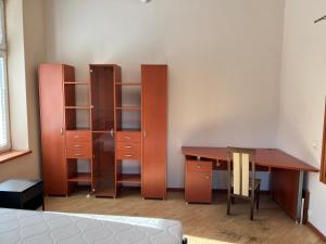 Ένα ή περισσότερα κρεβάτια σε δωμάτιο στο Test Lokalizacji