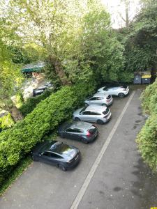 a group of cars parked in a parking lot at Spacious 3 bedrooms apartement 135 m & privative parking in Lille +5 photos