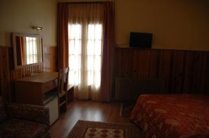 Hotel Bitouni tesisinde bir odada yatak veya yataklar