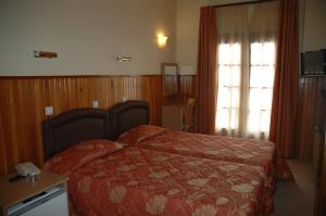 Voodi või voodid majutusasutuse Hotel Bitouni toas