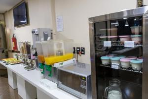 A cozinha ou kitchenette de Allegro Hotel