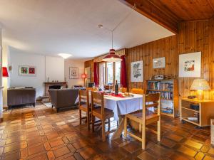 a kitchen and dining room with a table and chairs at Apartment Champbois by Interhome in Champéry