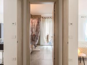 a hallway with a door leading to a bathroom at Apartment Arianna by Interhome in Arco