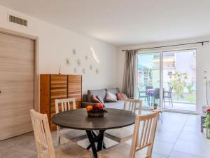 a kitchen and living room with a table and chairs at Apartment Arianna by Interhome in Arco