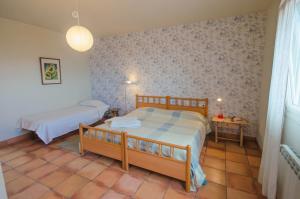 A bed or beds in a room at L'Albaida, tranquility, views of sea and mountains