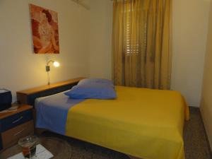 Postel nebo postele na pokoji v ubytování Cozy apartments and rooms Pavićini