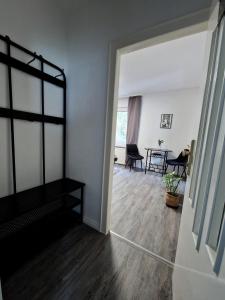 a living room with a bed and a dining room at Business Apartment am Bergmannsheil KH Wlan in Bochum