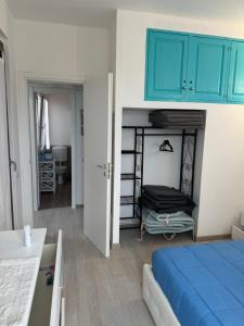 Кровать или кровати в номере Appartamento La Pelosa