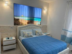 Кровать или кровати в номере Appartamento La Pelosa