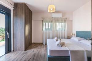 Posteľ alebo postele v izbe v ubytovaní Marinas Villas