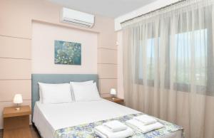 Posteľ alebo postele v izbe v ubytovaní Marinas Villas