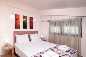 Posteľ alebo postele v izbe v ubytovaní Marinas Villas