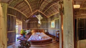 a bedroom with a large bed in a house at Luxury villa in Nosy Be with pool in Nosy Be