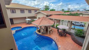 an aerial view of a house with a swimming pool at Hotel Galeria in Santiago