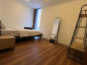 Ένα ή περισσότερα κρεβάτια σε δωμάτιο στο High Rise 2 Bedroom APT at Batam Center +12 φωτογραφίες
