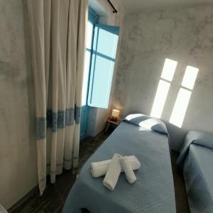 Postel nebo postele na pokoji v ubytování Paradice in Baunei