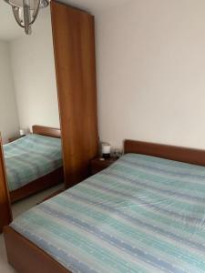 Ένα ή περισσότερα κρεβάτια σε δωμάτιο στο Appartamento zona centrale con barbecue